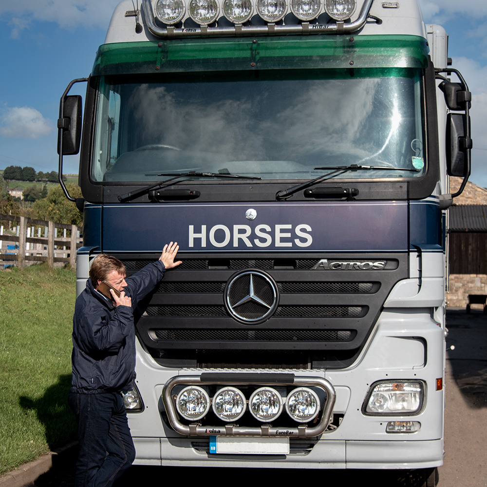 Laund-View-Paul_on_phone laund view international horse transport driver large wagon